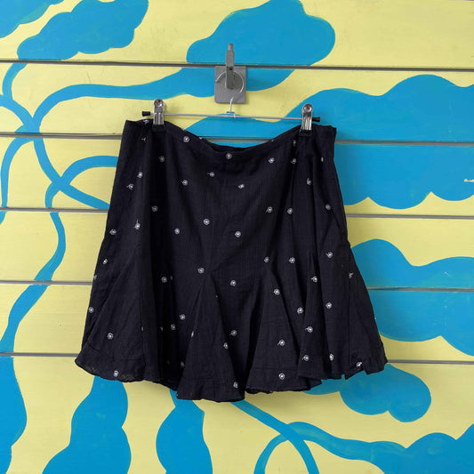 Minifalda negra flores blancas talla 8