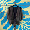Blusa brillante dorada
