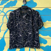 Camisa negra con dibujos blancos talla 12