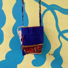 Bolso pequeño morado con detalles